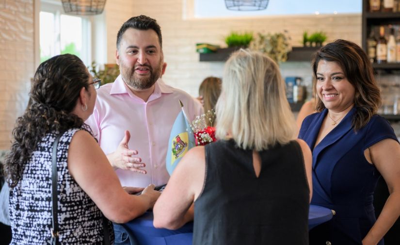 Jose talking with community members at a campaign gathering